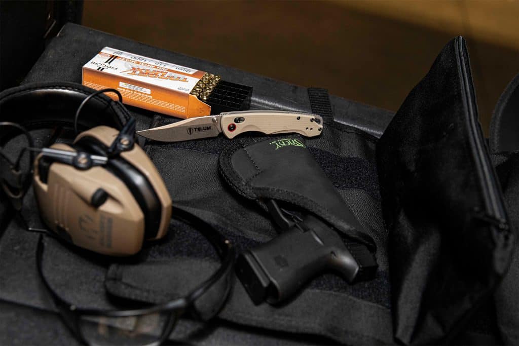 Sticky Holster with handgun and tactical range gear.