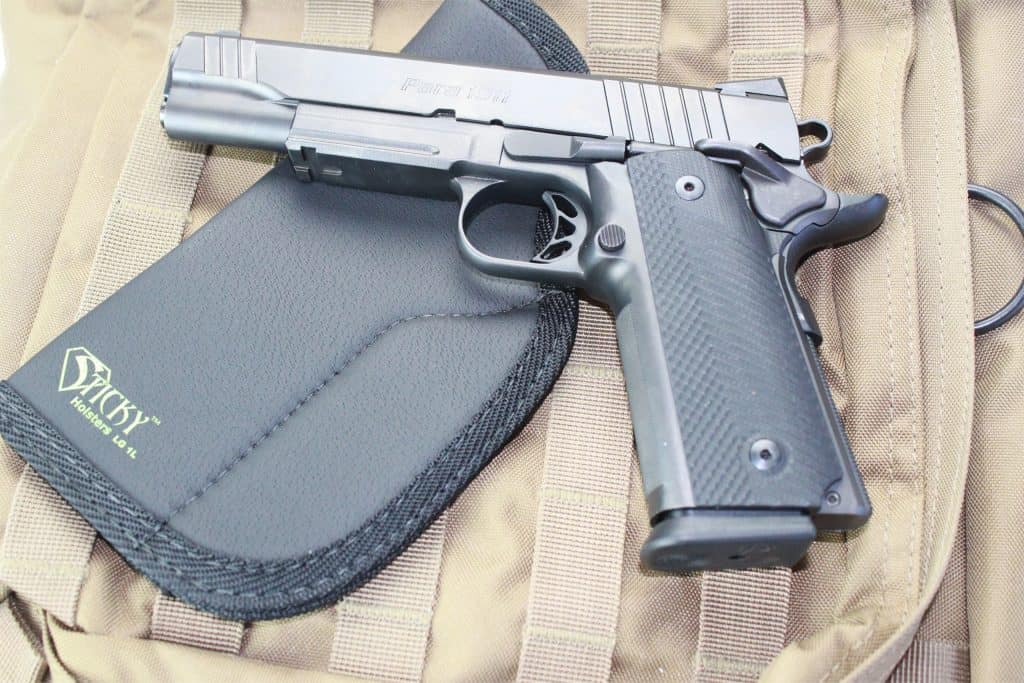 Para 1911 handgun with a Sticky Holster LG-1L on a tactical backpack.