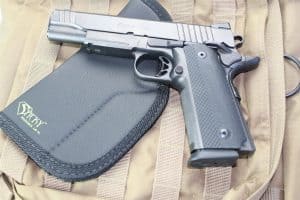 Para 1911 handgun with a Sticky Holster LG-1L on a tactical backpack.